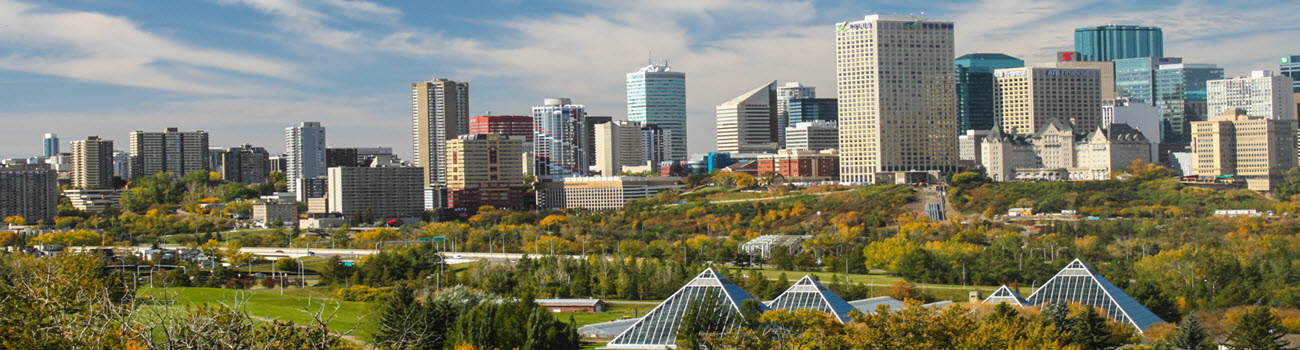 Individuals celebrating sobriety with arms raised, symbolizing the transformative journey of alcohol addiction treatment in vibrant Edmonton, Alberta